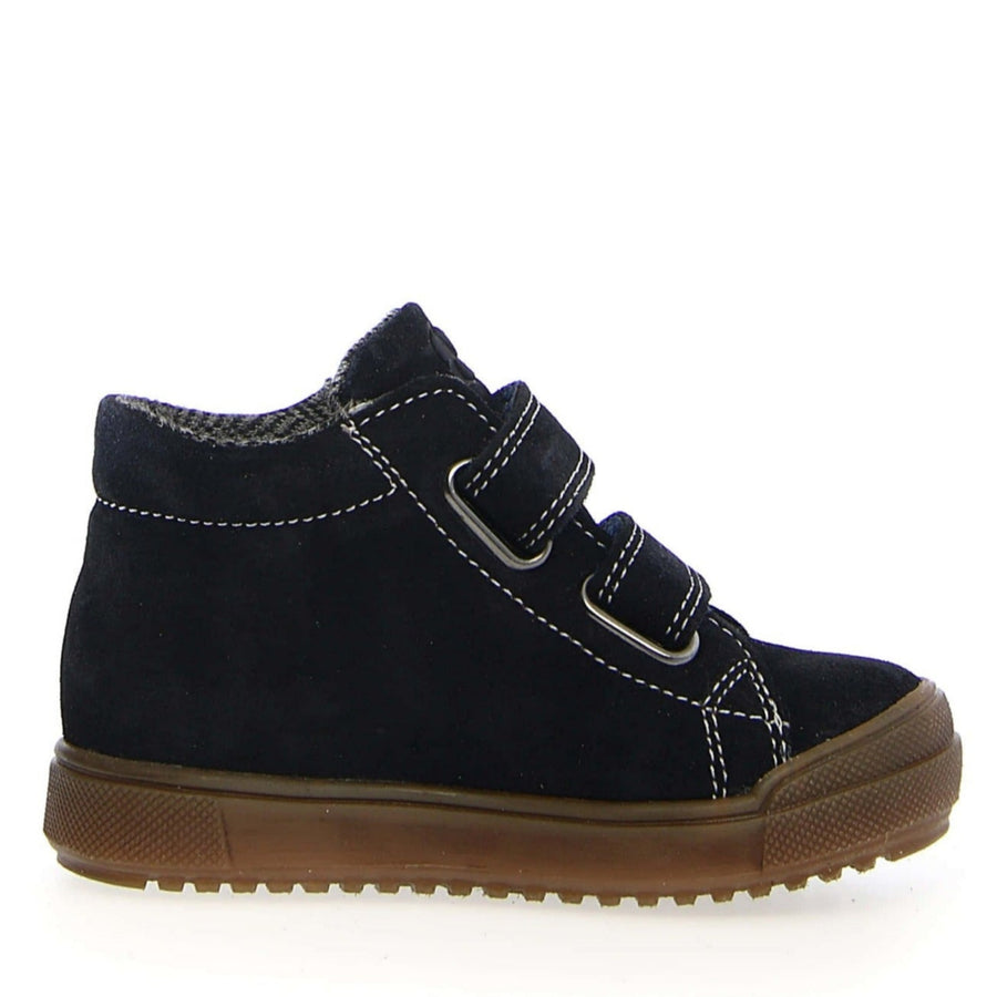 Black children's shoe with brown sole on a white background